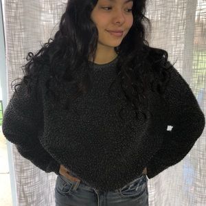 This is a darker grey sweater, purchased in Spain